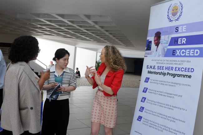 Noémie Wouters, ISA Secretariat, shows the S.H.E. See Her Exceed Initiative