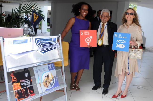 Tanesha Dixon and Noémie Wouters, ISA Secretariat, with Deryck Lance Murray, Trinidad and Tobago