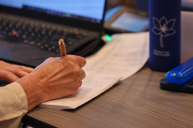 A delegate taking notes 