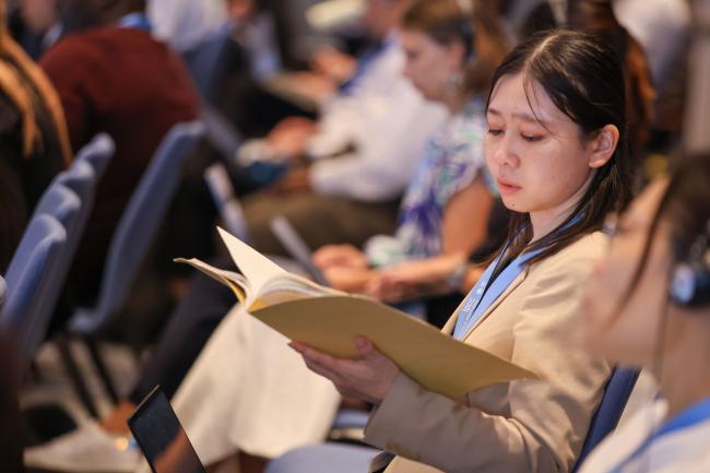 A delegate reading
