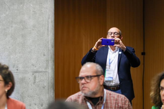 Delegate taking a picture