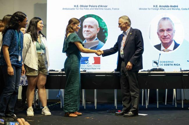 GYBN representative handing over the Youth Priorities on Ocean Conservation to Arnold André, Minister of Foreign Affairs and Worship, Costa Rica - Ocean Day -27oct24-photo