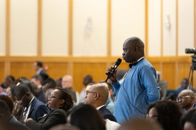 Delegates ask questions from the floor
