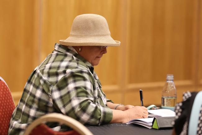 Delegate takes notes