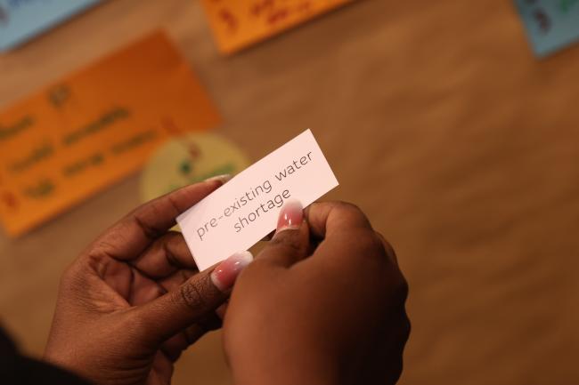 As part of a participatory game around the venue, delegates identify various risks that could lead to disasters