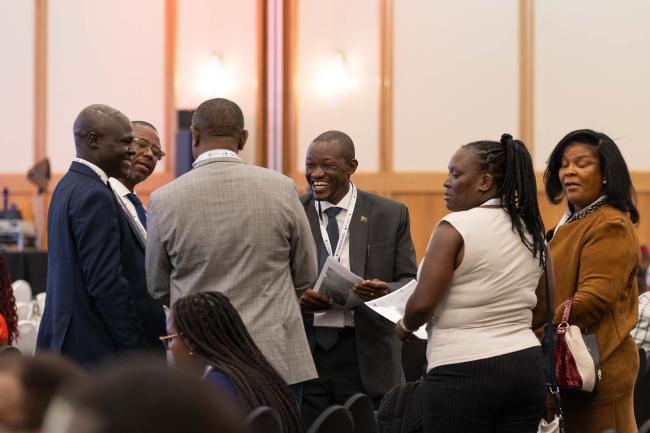Delegates meet informally between sessions