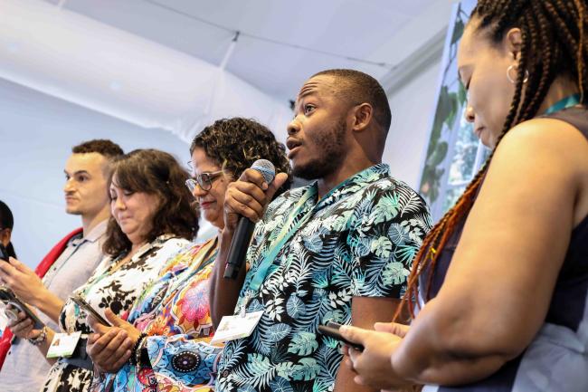 Kendon James, GYBN, performing a poem together with the team from GLISPA -27oct24-photo