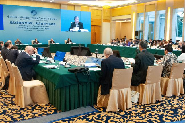 Delegates listen to the remarks by Liu Zhenmin, China Special Envoy for Climate Change