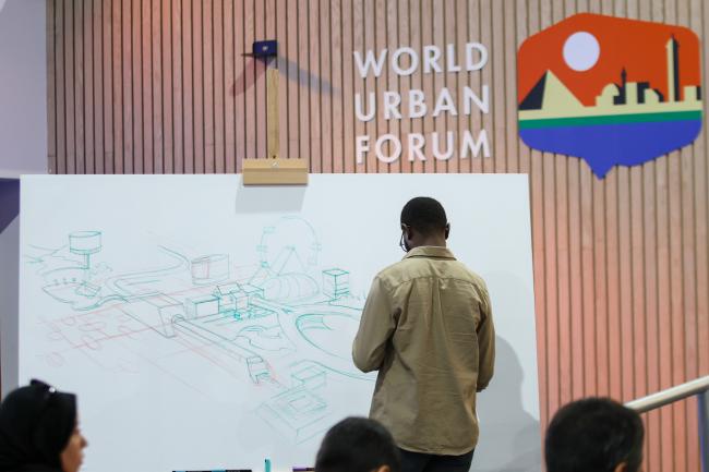 Victor Kariuki, visual artist, creating an urban sketch during the session