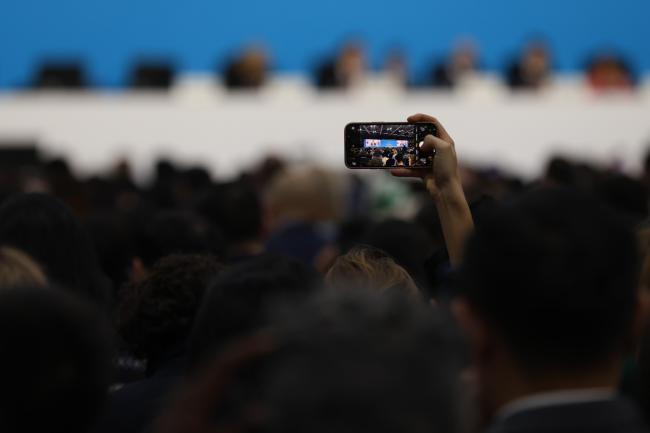 Delegate takes photo