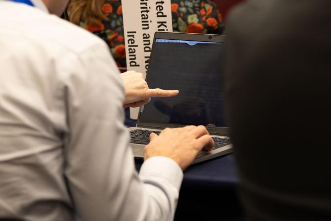 Delegates review the negotiating text