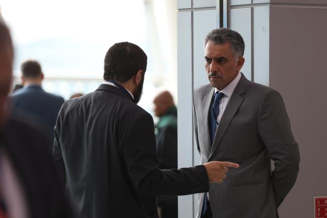 Abdulrahman AlGwaiz, Saudi Arabia, speaks with a delegate