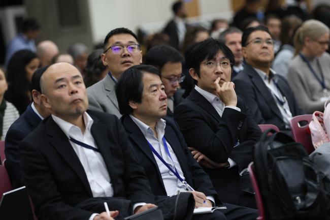 Delegates review the different proposals made during the session