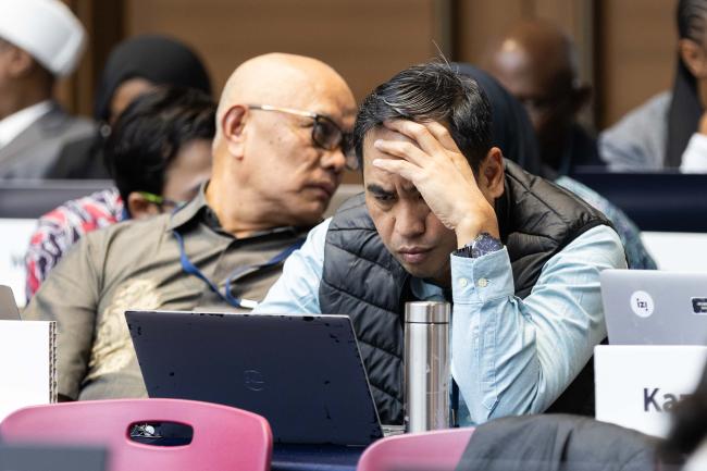 Delegates struggle through the text