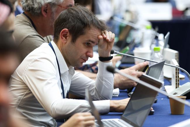 Delegates struggle through the text