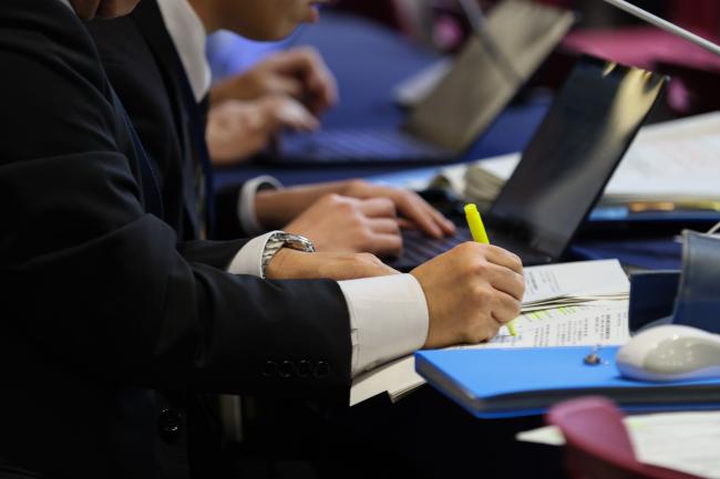 Delegates consider the text