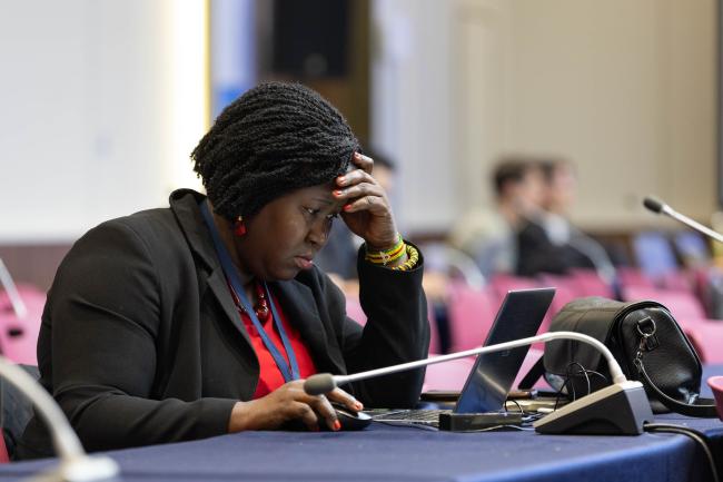 Delegates consider the text