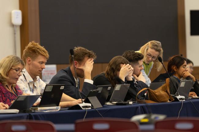 Delegates consider the new text proposed by the INC-5 Chair after it is released in the late afternoon