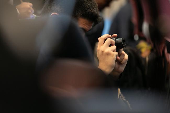 Delegate takes photos