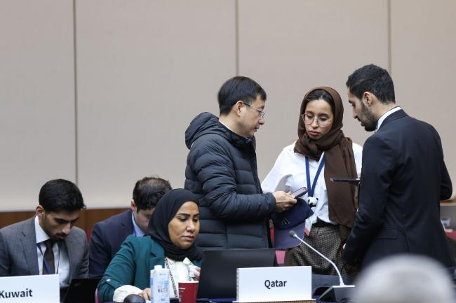 Delegates consult