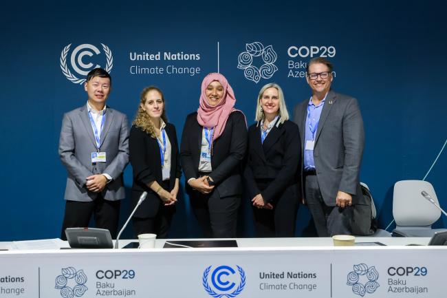Panelists gather for a group photo.