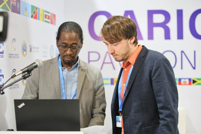 Orville Grey, Head, NAP Global Network Secretariat, and David Hoffmann, NAP Global Network