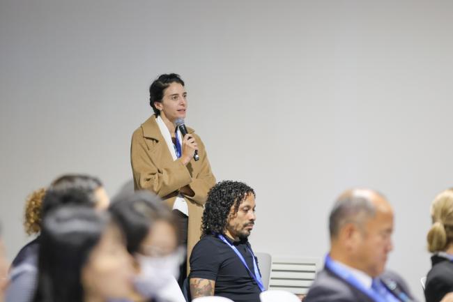 A participant posing a question
