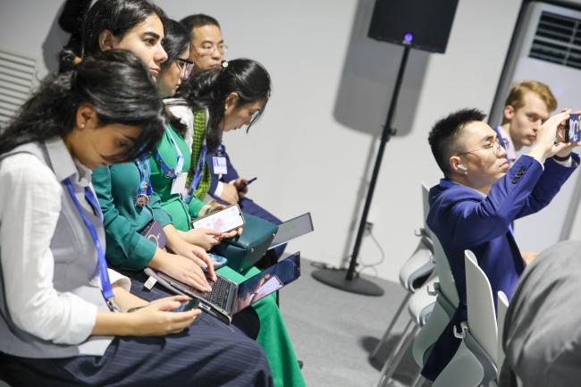 Participants taking notes