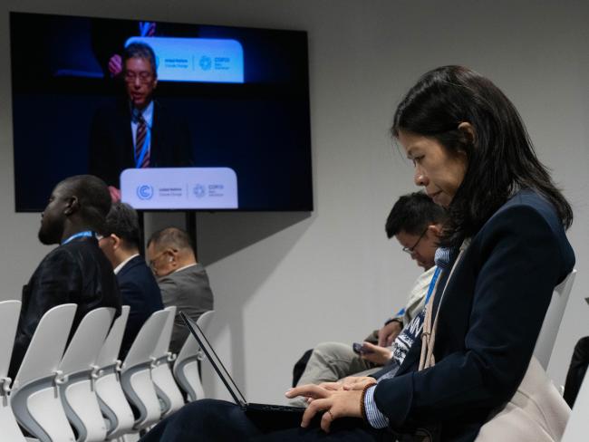 Participant taking notes during side event