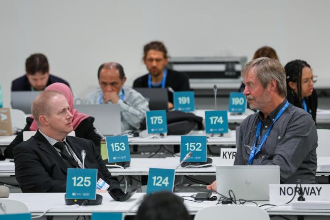 Phillip Eyre, UNFCCC Secretariat, and Peer Stiansen, Norway