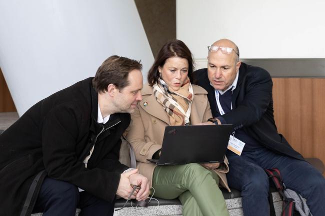 Delegates review the fifth iteration of the Chair's text as it is released