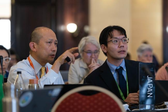Delegates from Japan consult