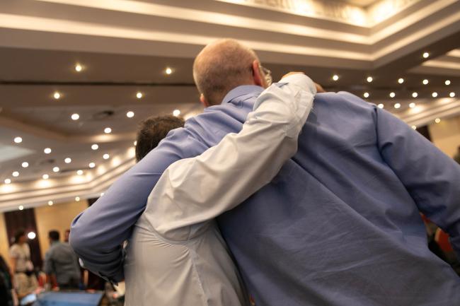 Delegates embrace
