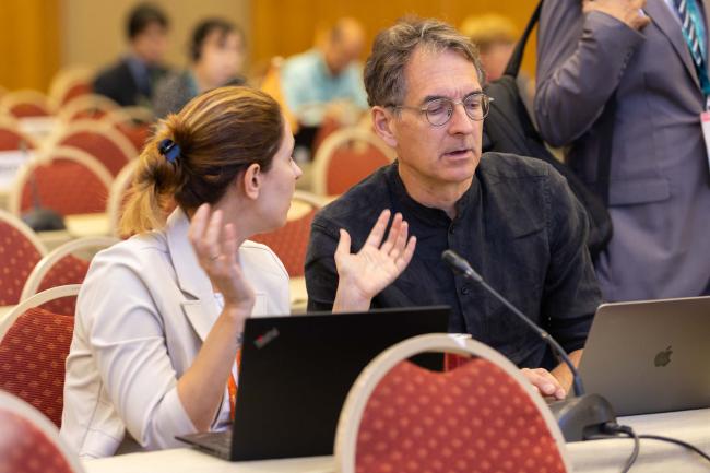 Delegates speak informally