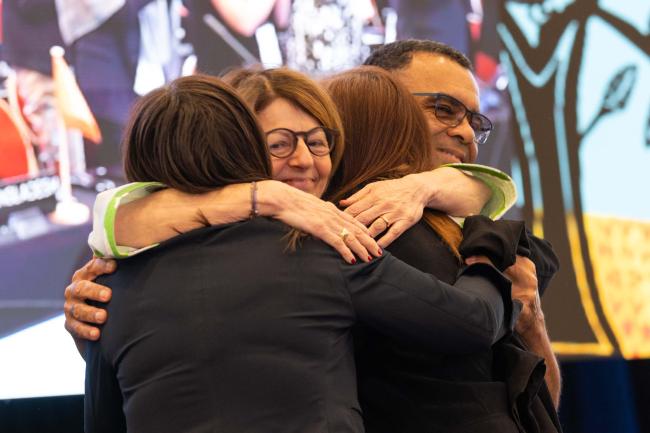 Anne Larigauderie, IPBES Executive Secretary, and David Obura, IPBES Chair, embrace the Nexus Assessment Co-Chairs as the report is adopted
