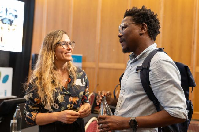 Participants speak informally after the session