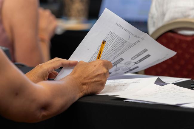 Participant takes notes