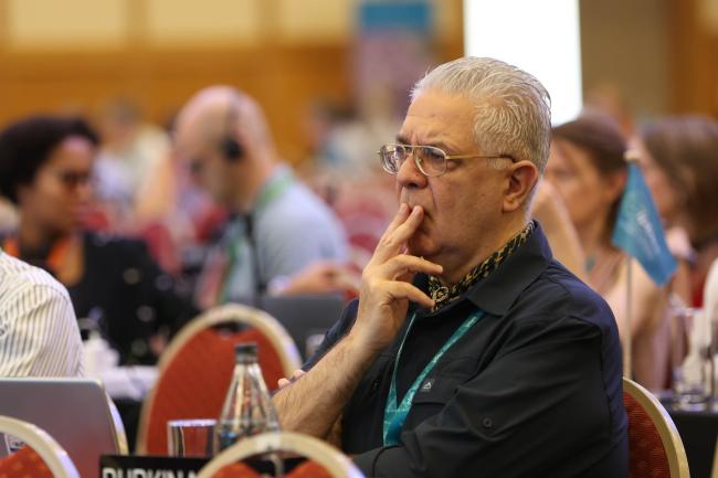 Delegates consider the text