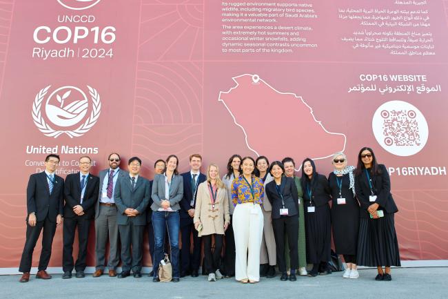 Delegates from JUSCANZ gather for a family photo