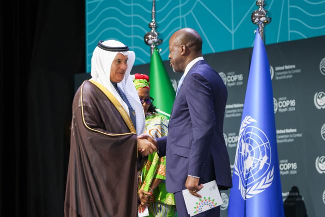COP 16 President Abdulrahman Abdulmohsen AlFadley, and Alain-Richard Donwahi, COP15 President 