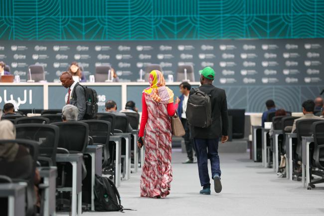 Delegates walk into the room 