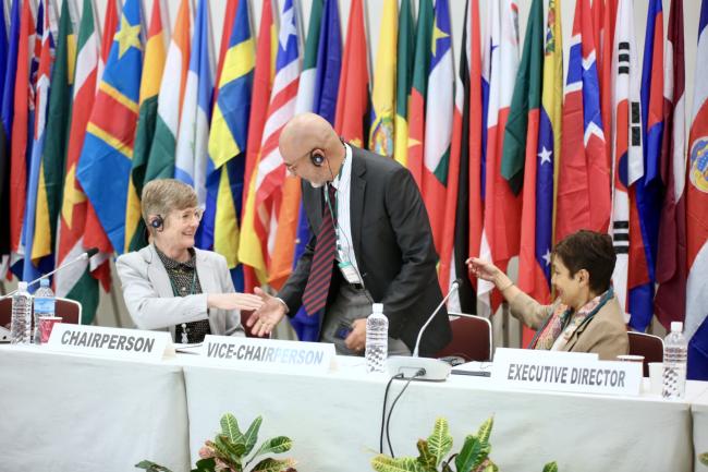 ITTC-60 Chair Anna Tyler (New Zealand) and ITTO Executive Director Sheam Satkuru welcome the Incoming ITTC-61 Chair Carlos Espinosa Peña (Panama).