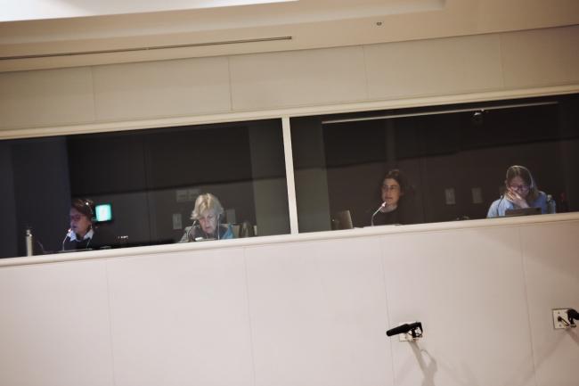 Interpreters working in booths during ITTC-60.