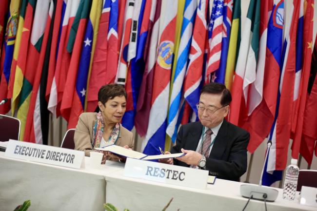 ITTO Executive Director Sheam Satkuru and Kaname Ikeda, President, RESTEC, signing a MOU.