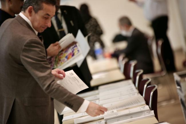 Participants reviewing documents at ITTC-60.