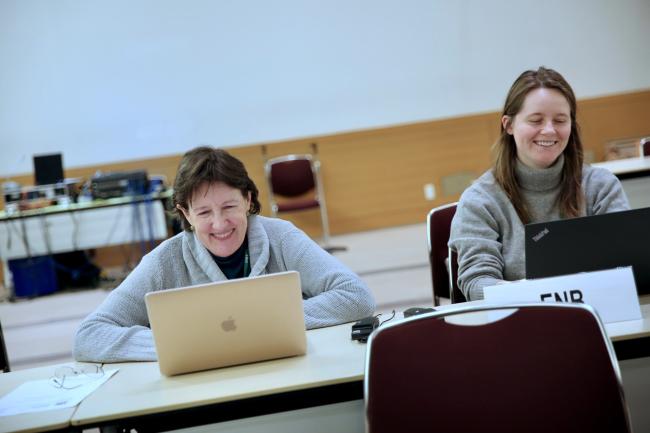 delegates sharing a light moment