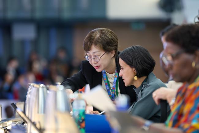COP 16 Secretary Jihyun Lee, with COP 16 President Susana Muhamad, Colombia
