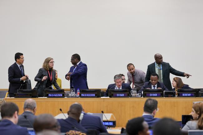 Co-Chairs, Co-Facilitators, and Secretariat consulting during a break