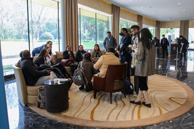 Delegates huddle in the corridors