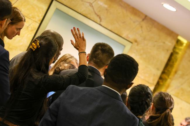 Raising hand to speak in a huddle 